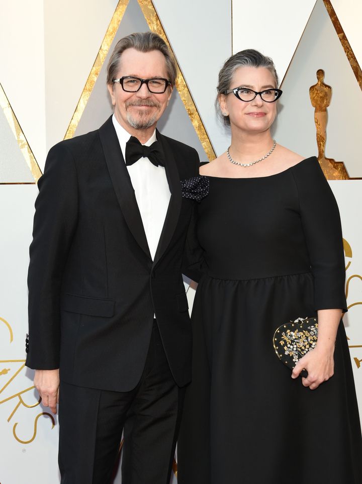 Gary Oldman and Gisele Schmidt arrive for the 90th Annual Academy Awards.