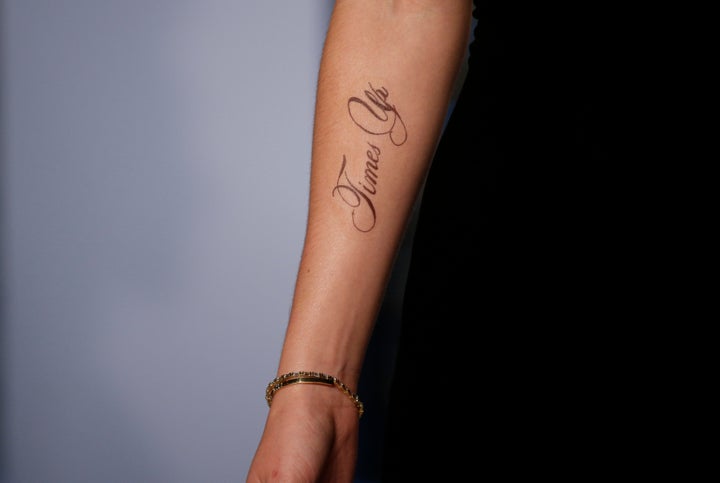 Watson's temporary tattoo sparked discussion about its lack of an apostrophe.