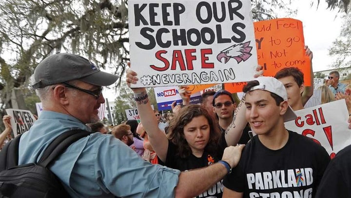 <p>Student survivors from Marjory Stoneman Douglas High School are greeted as they arrive at a rally for gun control reform on the steps of the state Capitol, in Tallahassee, Florida. No one really knows how often students are caught with guns at school because there is no good national data.</p>
