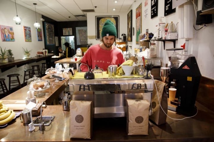 John Schwarz, co-owner of Weird Wave Coffee, prepares a beverage in the Boyle Heights, Los Angeles, shop. 