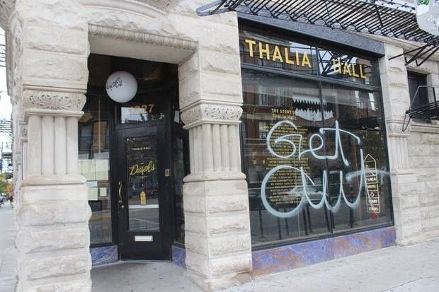 Graffiti demanding Dusek’s “Get out” was scrawled on the Pilsen neighborhood restaurant’s window in Chicago in October 2017. 