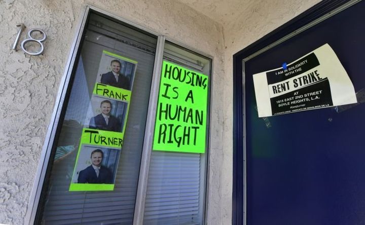 Signs and posters are seen on an apartment block where, with no rent control due to the year it was built, the landlord has increased some rents by as much as $800 in Boyle Heights, Los Angeles. 