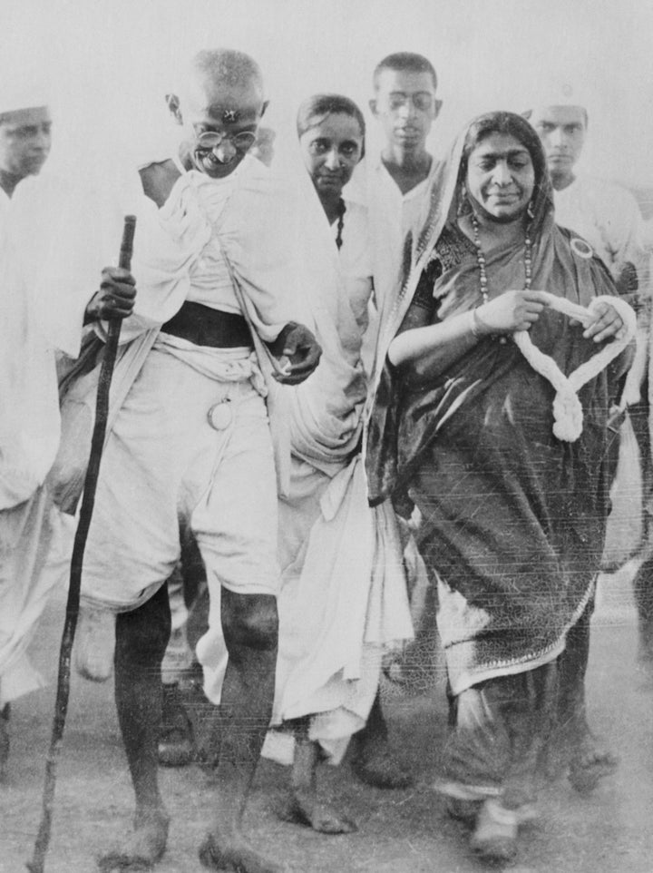 Mahatma Gandhi marches to a coastal village in 1930 to collect salt, in violation of British law in India.