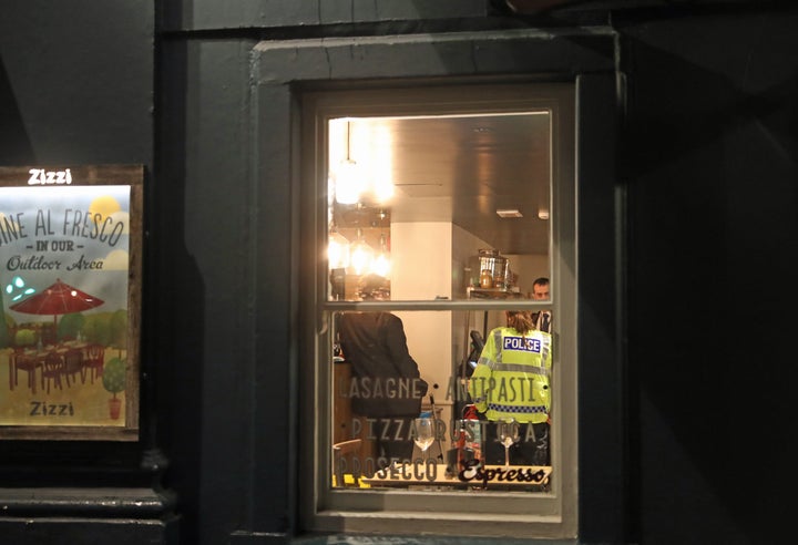 Police inside a Zizzi restaurant in Castle Street, Salisbury which has been closed in connection with an incident in which former Russian double agent Sergei Skripal was left critically ill by exposure to an unknown substance.