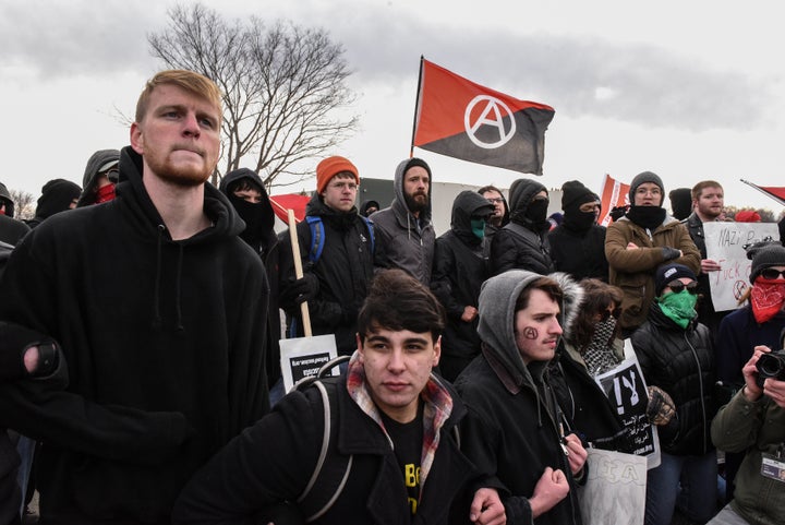 Members of the various anti-fascist groups and other protesters lock arms together on the campus of Michigan State University outside of a Richard Spencer speech in East Lansing, Michigan, on March 5, 2018. 