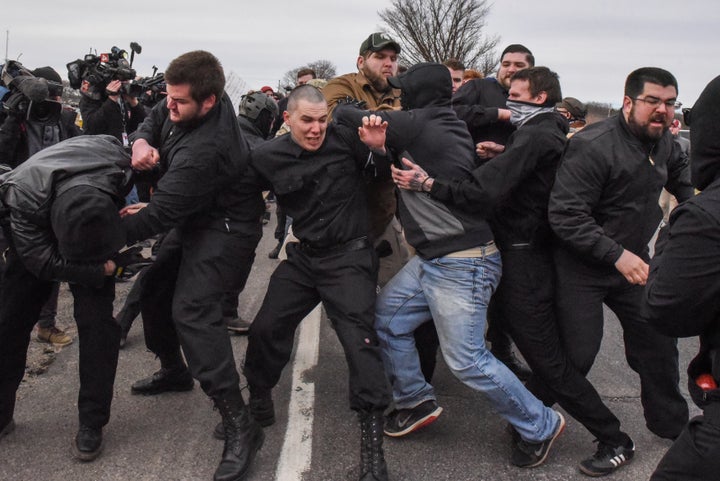 Members of the so-called alt-right, including members of the Traditionalist Worker Party, fight with protesters outside of a Richard Spencer speech on the campus of Michigan State University on March 5, 2018.