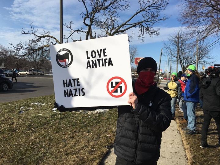 An anti-fascist protester on March 4, 2018, outside a hotel near Detroit where neo-Nazis had reserved rooms.