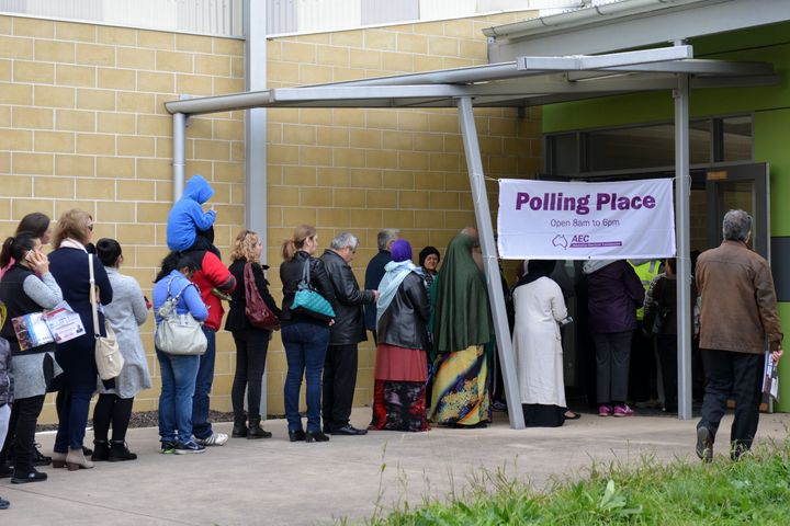 Australian voters line up on election day to determine all 226 members of the Parliament in Melbourne on July 2, 2016. 