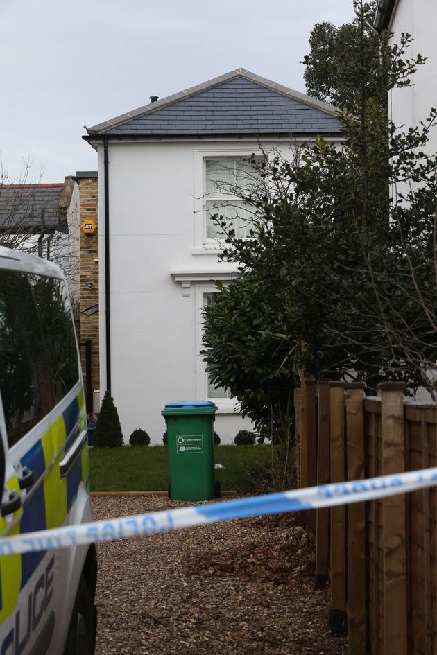 Police at the house in South Road, Twickenham, where a woman was found dead