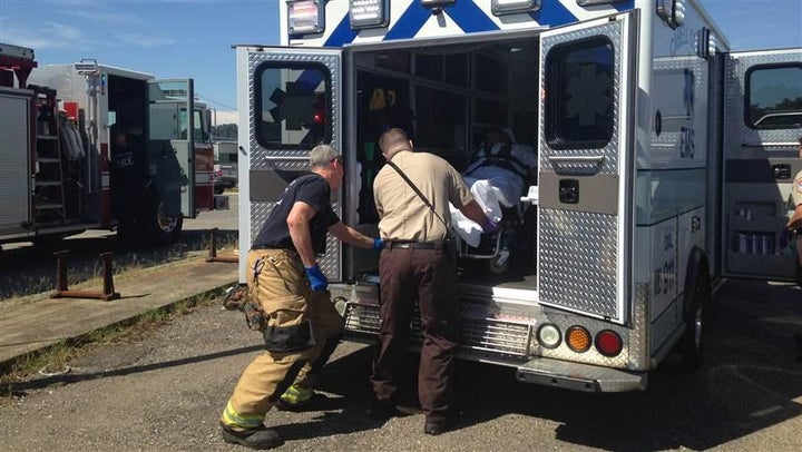 Emergency medical personnel load an overdose victim into an ambulance in Huntington, West Virginia. Nationwide, an increasing number of people who are rescued from a drug overdose refuse to be transported to a hospital.