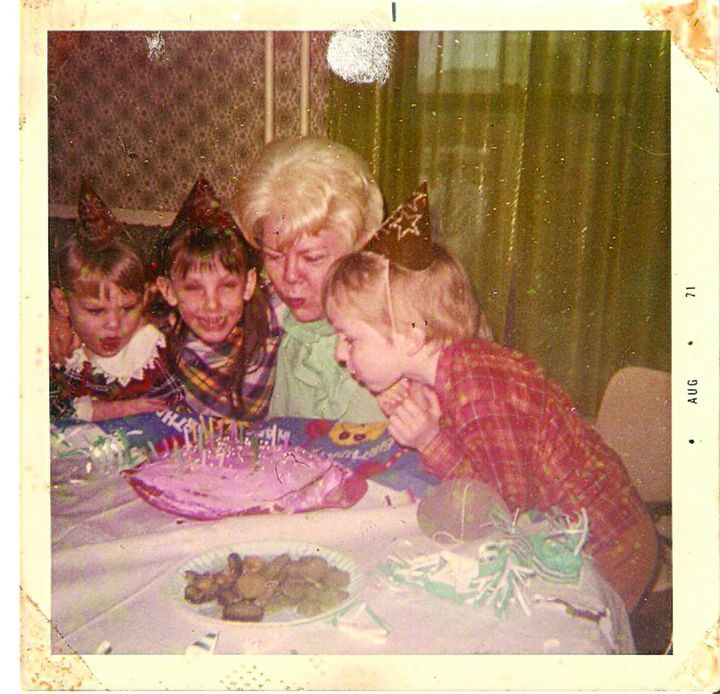 Michael Broussard at age 6 in 1971 and his sisters Mary, left, and Ruthie, and his grandmother.