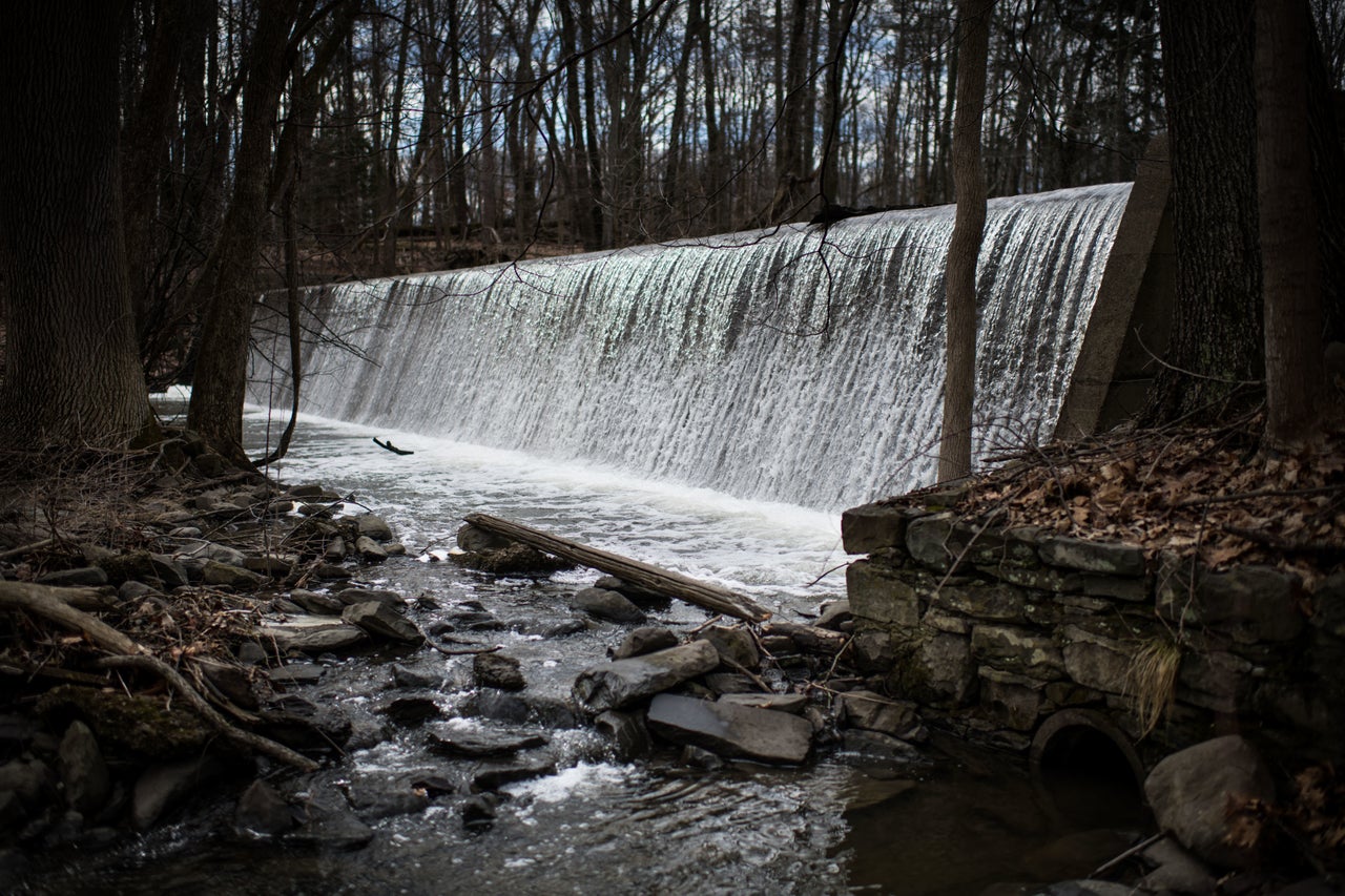 A dam overflows with water diverted from Silver Stream, the body of water that would normally feed into the Lake Washington reservoir but was discovered to be contaminated with the chemical PFOS.