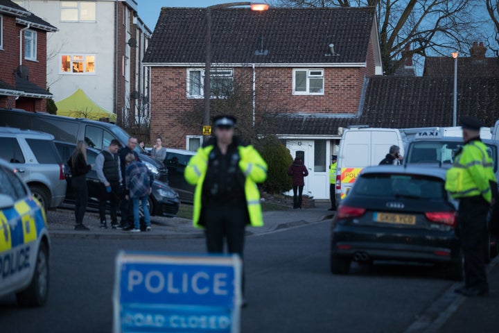 Police officers search the home of Sergei Skripal.