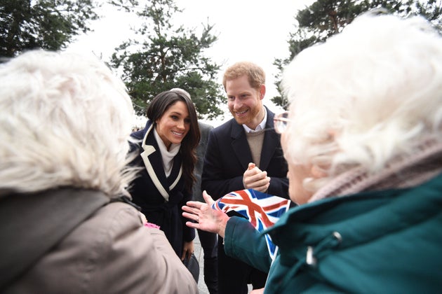 Prince Harry and Meghan Markle talk to sisters Jean Dickinson and Irene Gould while on a walkabout during a visit to Millennium Point in Birmingham