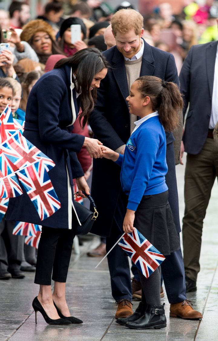 Meghan shakes hands with Sophia Richards, a pupil from the Oasis Academy Warndon in Worcester