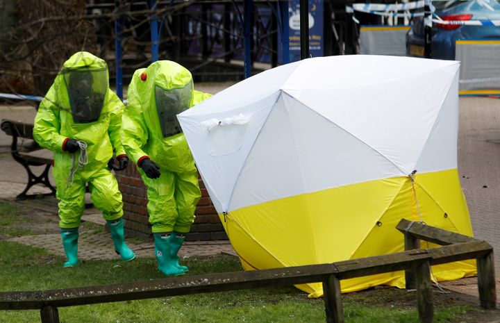 The forensic tent, covering the bench where Sergei Skripal and his daughter Yulia were found, is repositioned by officials in protective suits in the centre of Salisbury.