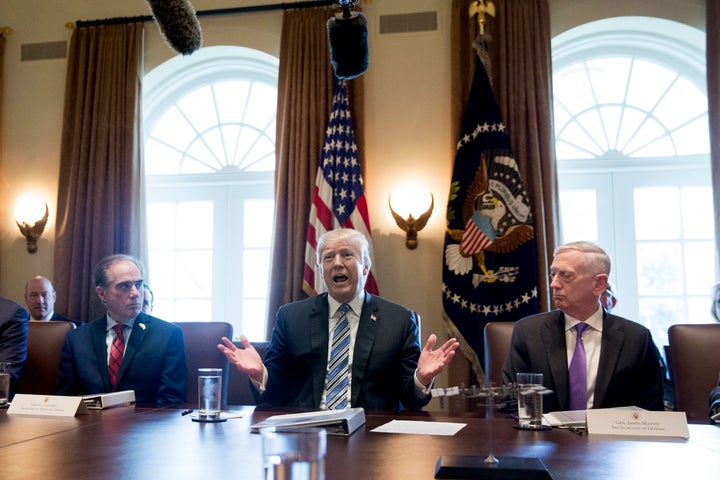 Trump is seen during Thursday's cabinet meeting, while flanked by U.S. Secretary of Defense Jim Mattis, to the right, and U.S. Secretary of Veterans Affairs David Shulkin, to the left.