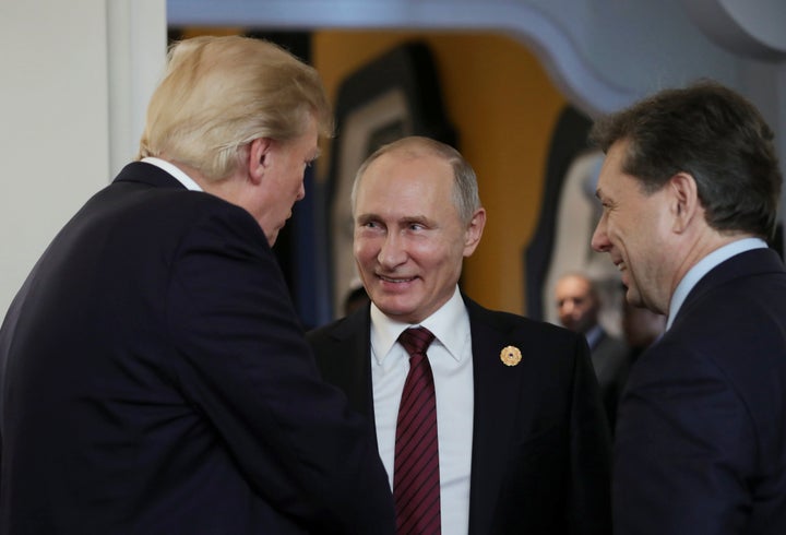 U.S. President Donald Trump and Russian President Vladimir Putin talk during the APEC summit in Danang, Vietnam, on Nov. 11, 2017.