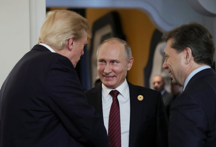 U.S. President Donald Trump and Russian President Vladimir Putin talk during the APEC summit in Danang, Vietnam, on Nov. 11, 2017. 