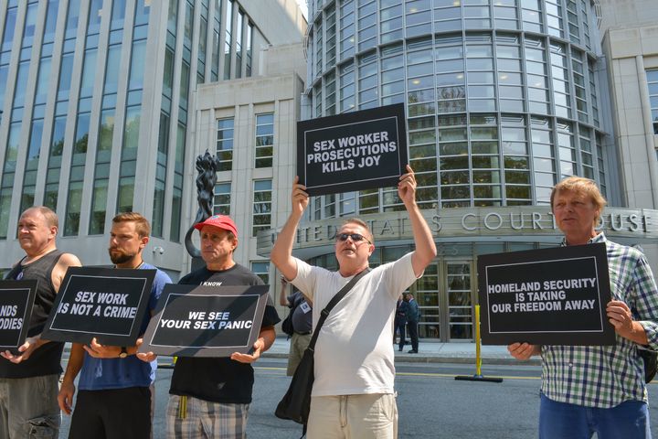 Activists protest a raid against a male escort service outside the federal courthouse in Brooklyn in August 2015.