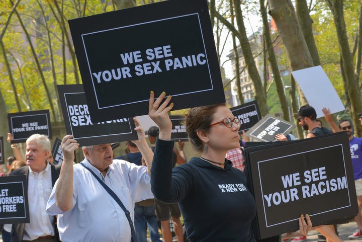 Activists from the LGBTQ community held a rally outside the federal courthouse in Brooklyn on Aug. 25, 2015, to protest a raid on a male escort service site.