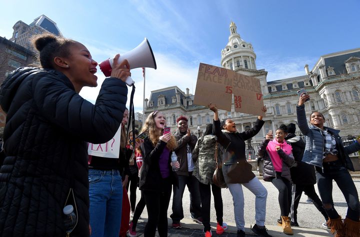 Students are seen participating in Tuesday's walkout to protest gun violence in schools and Baltimore.