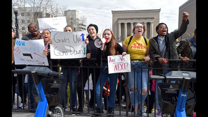 Baltimore students, seen outside of City Hall on Tuesday, participated in a walkout to protest gun violence in schools and the city.