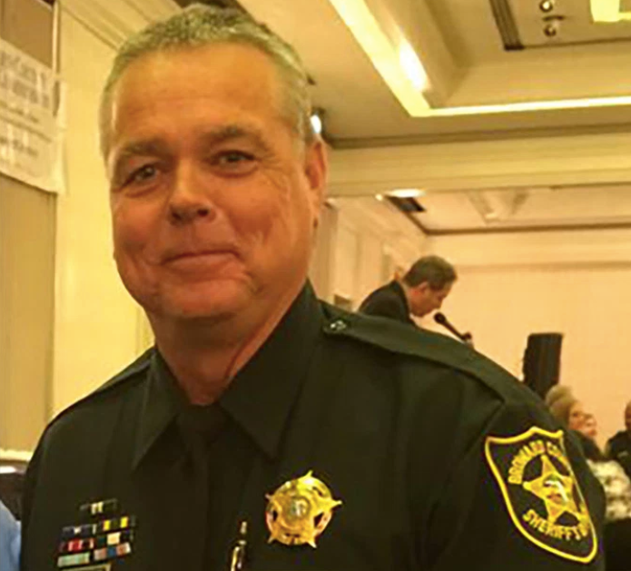 Deputy Scot Peterson told other officers not to enter the building as a gunman was shooting students.