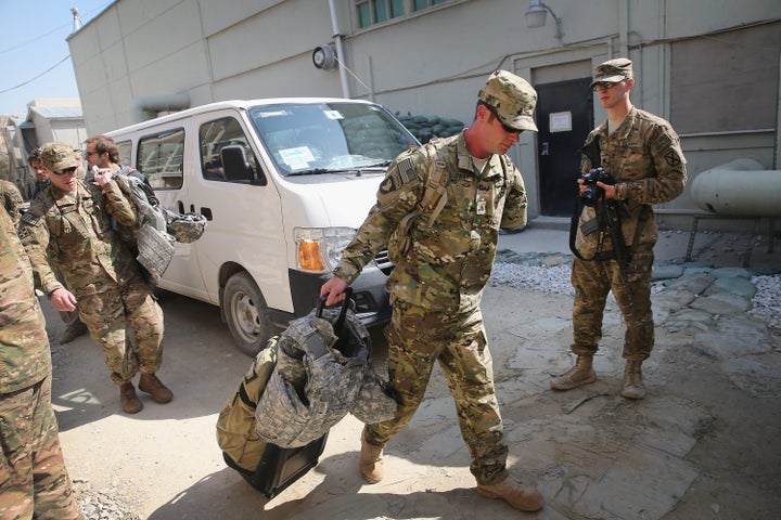 Retired Army Sgt. Noah Galloway of Birmingham, Alabama, arrives at Afghanistan's Bagram Airfield on March 12, 2014. Galloway lost an arm and a leg to an explosion in Iraq in 2005. He was one of five wounded soldiers visiting Afghanistan with the Troops First Operation Proper Exit program, which brings wounded servicemen back to Iraq and Afghanistan to help them come to terms with their injuries.