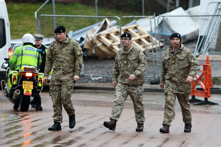 <strong>Military personnel are seen outside Salisbury District Hospital where around 180 troops have been deployed </strong>