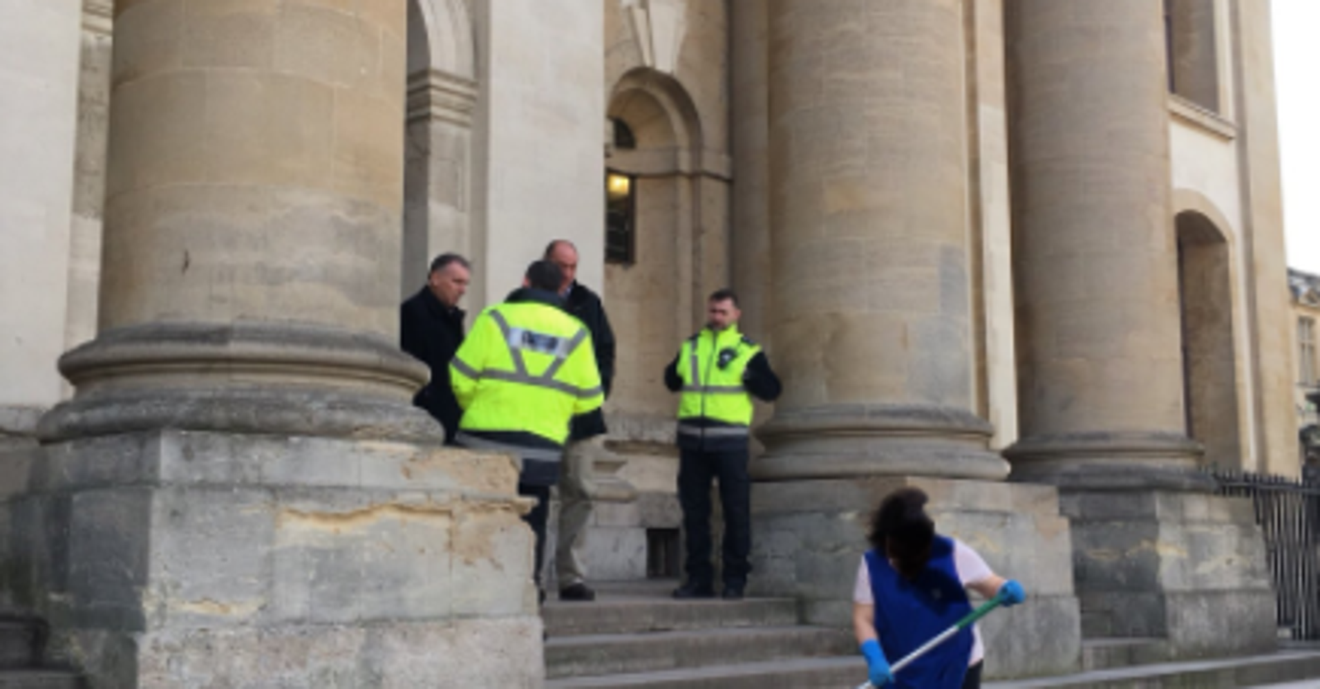 4 Men Stand Around While Woman Scrubs 'Happy International Women’s Day' From Steps 4 Men Stand Around While Woman Scrubs 'Happy International Women’s Day' From Steps