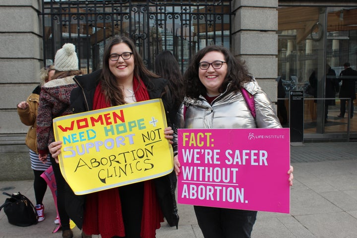 Roisin Ni Fhloinn, left, demonstrates against abortion outside Ireland's lower house of Parliament with her sister.