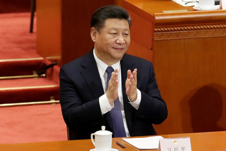 Chinese President Xi Jinping applauds after the Chinese parliament passed a constitutional amendment lifting presidential term limit, at the third plenary session of the National People's Congress at the Great Hall of the People in Beijing, China on March 11, 2018. 