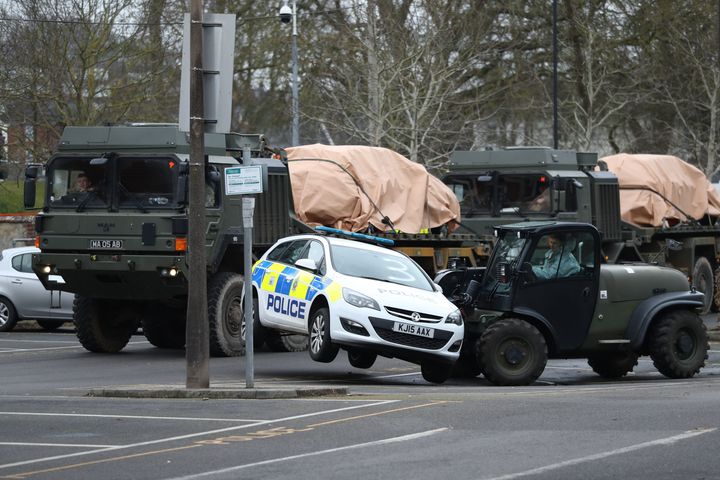 <strong>A police car being taken away by military personnel from College Street Car Park in Salisbury.</strong>