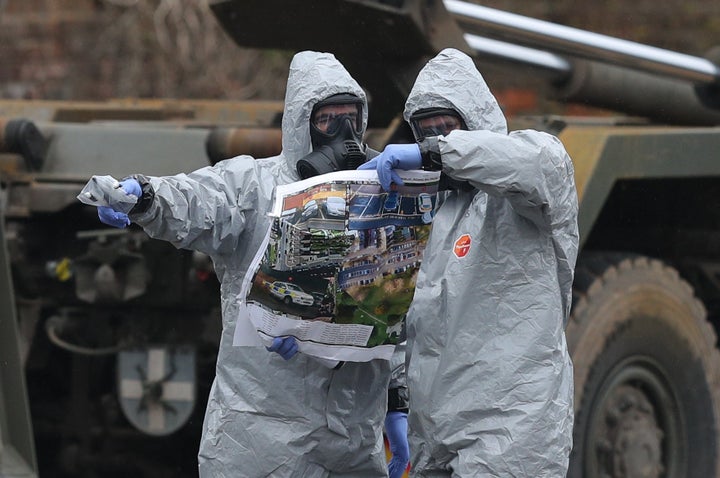 Military personnel looking at a diagram in College Street Car Park in Salisbury, as police and members of the armed forces probe the suspected nerve agent attack on Russian double agent Sergei Skripal.