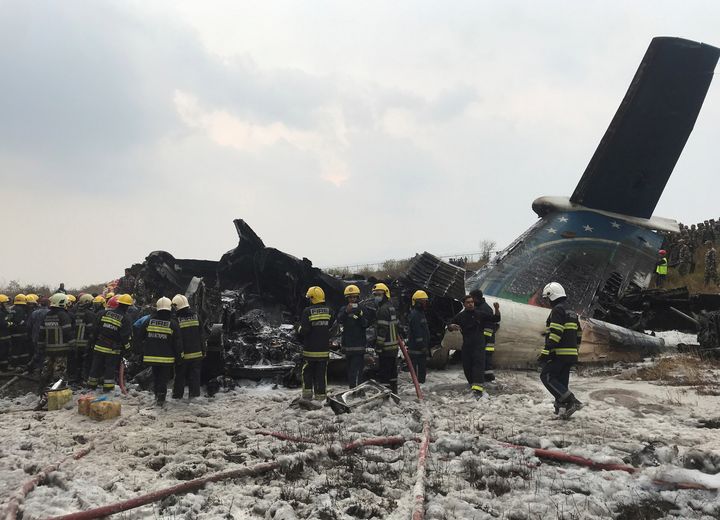 Rescue workers at Kathmandu Airport after a passenger plane crashed upon landing 