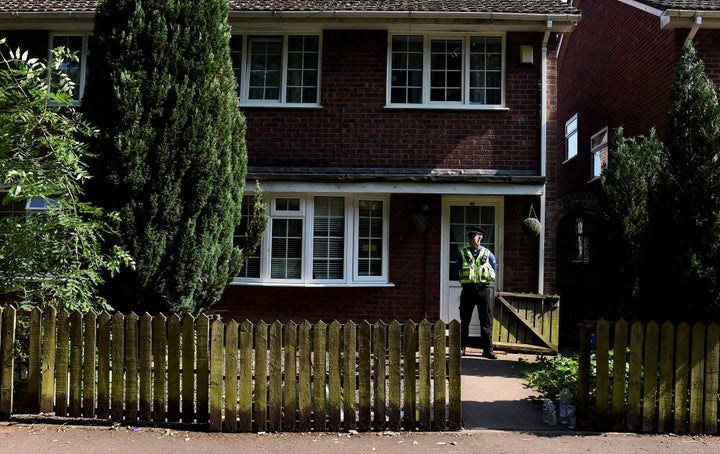 A police officer stands outside the home of Darren Osborne, in Cardiff, Wales, on June 20, 2017. He was convicted of driving