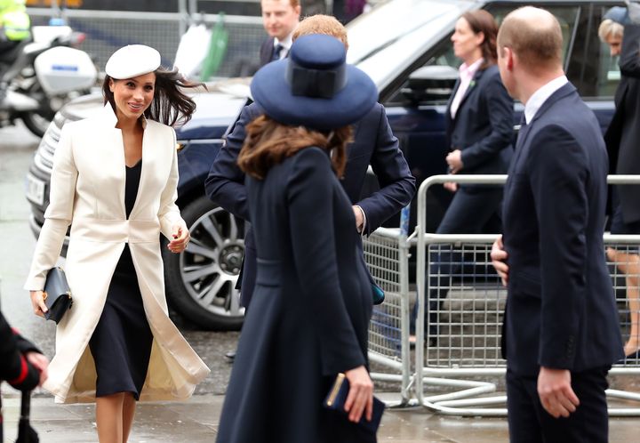 Meghan Markle makes her way into the service behind Prince William, the Duke of Cambridge, and his wife, Catherine, Duchess of Cambridge.