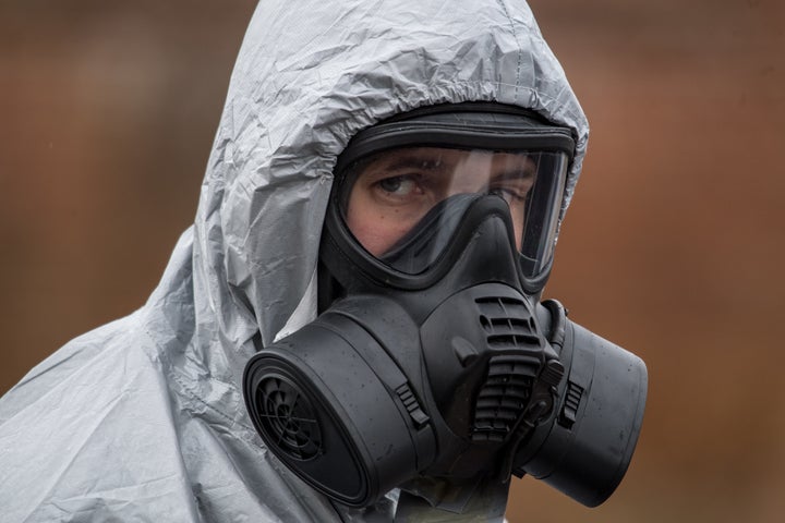 Military personnel wearing protective suits in Salisbury.