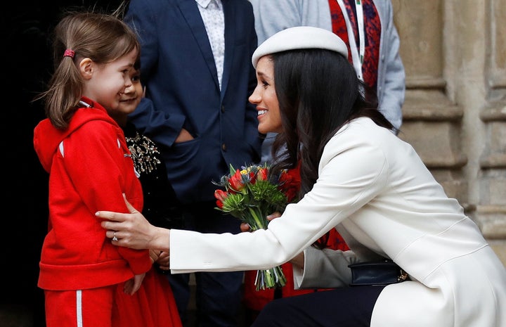 Greeting schoolchildren after the Commonwealth service.