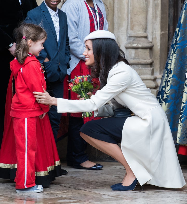 The soon-to-be duchess crouched down to meet a young fan.