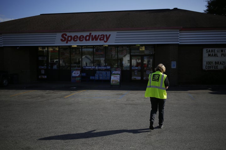 An employee walks through the parking lot of a Marathon Petroleum Corp. Speedway gas station in Huntington, West Virginia, in 2016. Marathon Petroleum Corp. paid its CEO 935 times more than it paid its median employee in 2017, according to a new disclosure.