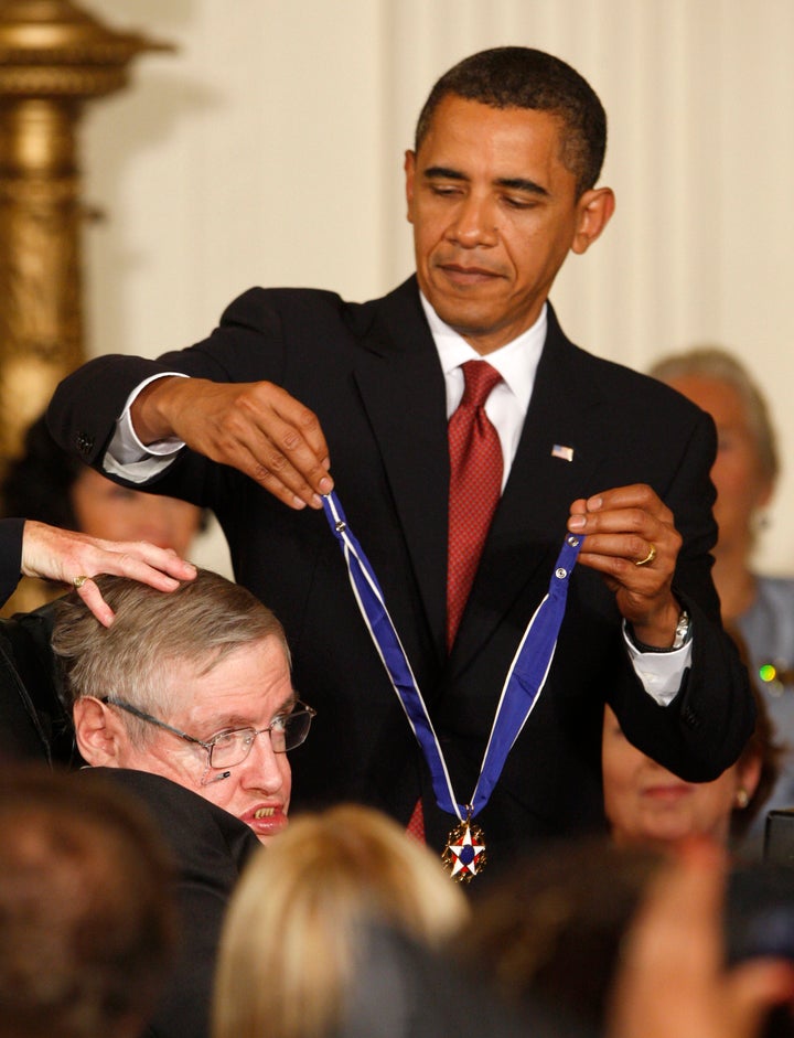 President Barack Obama presents the Medal of Freedom to scientist Stephen Hawking during a ceremony in the East Room of the White House in Washington, August 12, 2009.