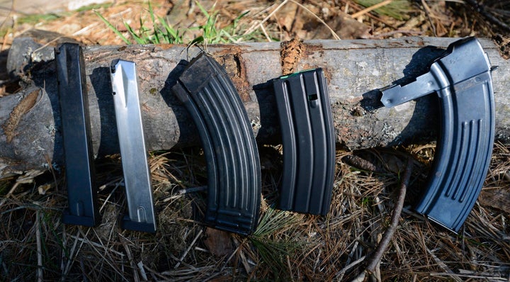 A variety of high-capacity magazines. The two on the left are magazines for handguns, while the next three are for milit