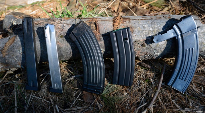 A variety of high-capacity magazines. The two on the left are magazines for handguns, while the next three are for military-style rifles.