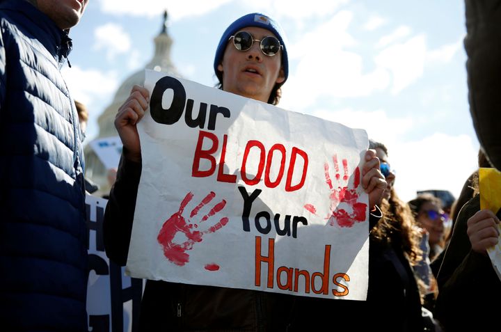 A sign reading "Our Blood Your Hands" is seen during a protest at the U.S. Capitol in Washington, D.C. on Wednesday.