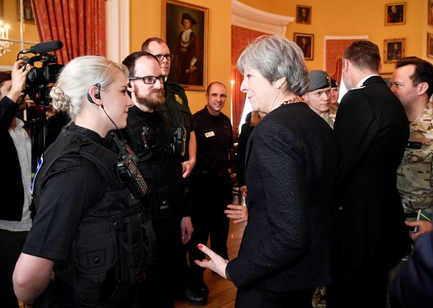  Prime Minister Theresa May speaks to local officials and members of the emergency services as she visits Salisbury