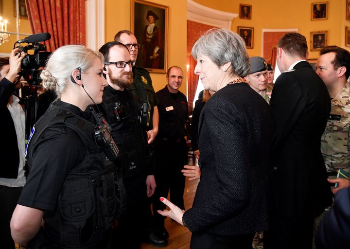  Prime Minister Theresa May speaks to local officials and members of the emergency services as she visits Salisbury