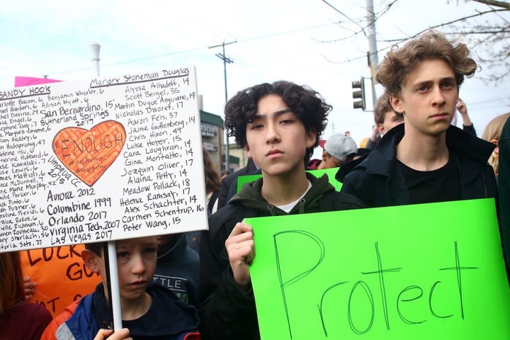 Students from Adams Elementary School and Ballard High Schooll in Seattle, Washington take part in a national walkout to protest gun violence. 