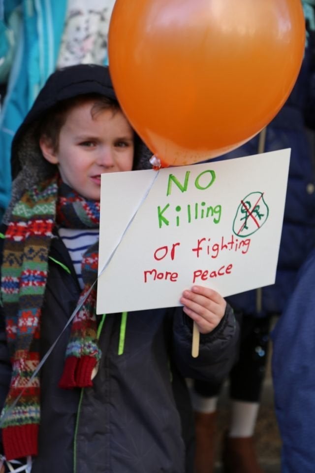 Students at Science, Language and Arts International School participate in a walkout to address school safety and gun violence on March 14, 2018 in Brooklyn, New York. 